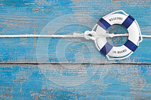 Blue wooden background - Welcome on board - holiday or cruising photo