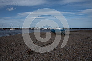 Blue wooden boat and anchor chain