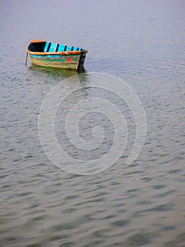 Blue wooden boat on the lake