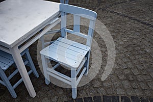 Blue wooden chair in old town of Cunda