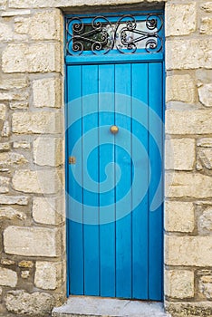 Blue wooden door in Erice, Sicily, Italy