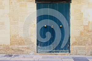 Blue wooden doors knockers ancient building, Lecce, Italy