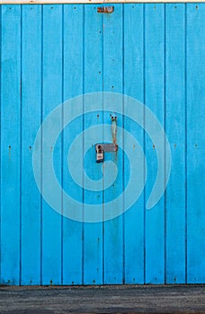 Blue wooden doors with a locker