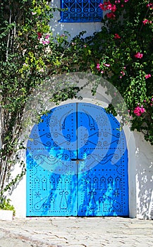 Blue wooden garage gate in tunisian arabic style photo