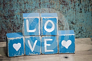 Blue wooden love blocks with hearts