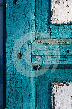Blue wooden old door with cracking paint