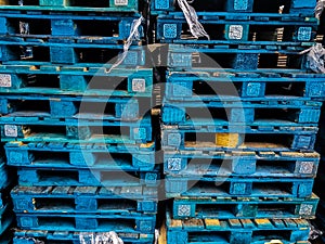 Blue wooden pallets stacked toghter photo