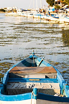 Blue wooden rowing boat.