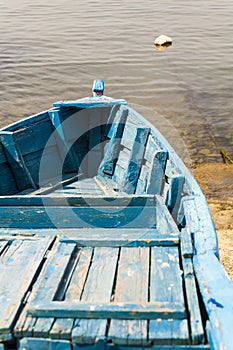 Blue wooden rowing boat.