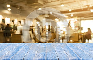 Blue Wooden table with blurred of coffee shop background, product display