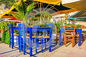 Blue wooden tables and chars in restaurant