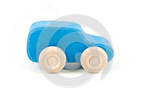 Blue wooden toy car isolated on a white background