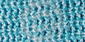 blue woolen material with an interesting pattern