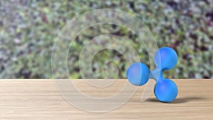 Blue xrp ripple gold sign icon on table blur leaves background. 3d render isolated illustration, cryptocurrency, crypto, business