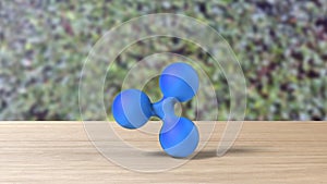 Blue xrp ripple gold sign icon on table blur leaves background. 3d render isolated illustration, cryptocurrency, crypto, business