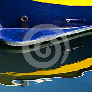 Blue and Yellow Boat with Reflection