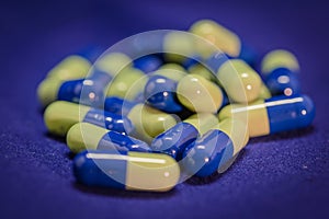 Blue and yellow capsules