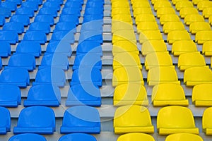 Blue and yellow empty stadium seats