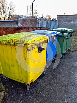 Blue, yellow and green Recycle Bin  containers to separate materials