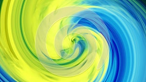 Blue and yellow ink in the background of water on a black background, while creating beautiful swirl shapes.