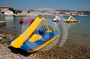 Blue and yellow pedalo boat on seaside at Krk -Croatia