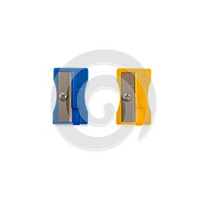 Blue and yellow pencil sharpeners isolated on white, closeup, School supply