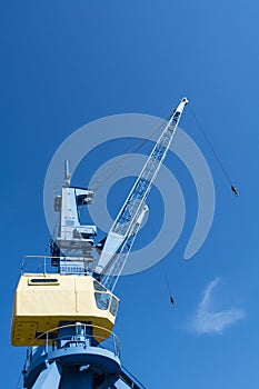 Blue and yellow port crane