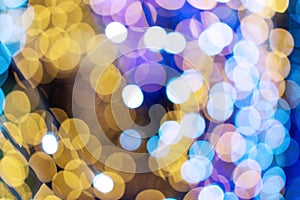 Blue, yellow and white blur background with defocused light bokeh. Abstract bokeh background. Christmas bokeh lights