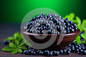 Blueberries in a black bowl. Biologically active supplement