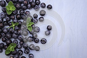 Blueberries on blue wooden background