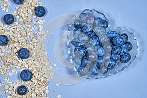 Blueberries and bunting background. snack. muesli. plate heart. with love.