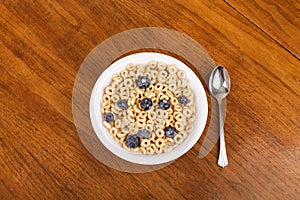 Blueberries in Cereal with Spoon