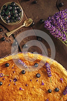 Blueberries and lavander cheesecake served on oven with berries and flowers, still life for patisserie, healthy cake