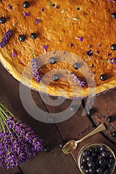 Blueberries and lavander cheesecake served on oven with berries and flowers, still life for patisserie, healthy cake