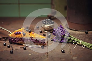 Blueberries and lavander cheesecake served on oven with berries and flowers, still life for patisserie, healthy cake