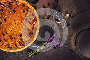 Blueberries and lavander cheesecake served on oven with berries and flowers, still life for patisserie, healthy cake