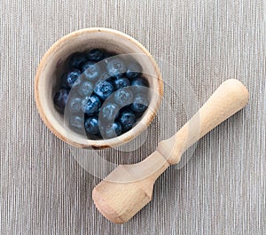 Blueberries in mortar on towel