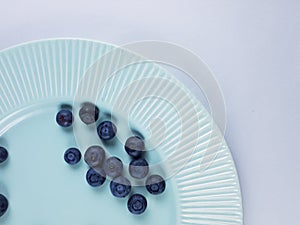 Blueberries on plate, fruits for healthy life