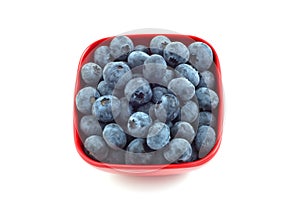 Blueberries in red dish