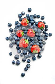 Blueberries and strawberries on white background