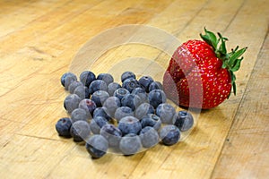 Blueberries and a strawberry o