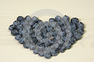 Blueberries summer berry on wooden table. Vitamin C, E, P, PP, B carotene flavonoids ascorbic acid. Organic fresh