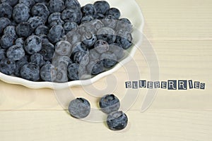 Blueberries summer berry on wooden table. Vitamin C, E, P, PP, B carotene flavonoids ascorbic acid. Organic fresh