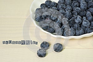 Blueberries summer berry on wooden table. Vitamin C, E, P, PP, B carotene flavonoids ascorbic acid. Organic fresh