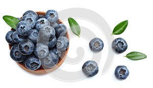 blueberries in wooden bowl isolated on white background. top view
