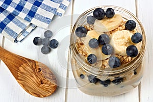 Blueberry and banana overnight oatmeal in mason jar photo