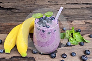 Blueberry and banana smoothies purple colorful fruit juice milkshake blend beverage healthy high protein the taste yummy.