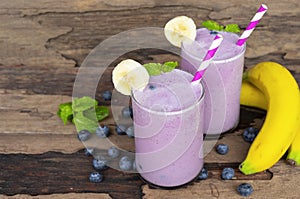 Blueberry and banana smoothies purple colorful fruit juice milkshake blend beverage healthy high protein the taste yummy.