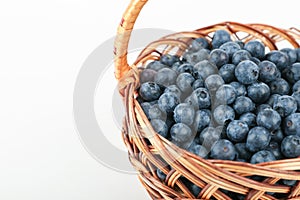 Blueberry berries in wicker basket