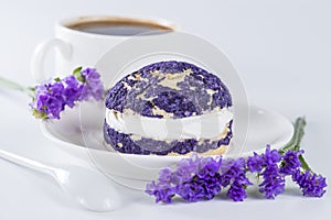 Blueberry cake shu decorated with purple flowers of statice